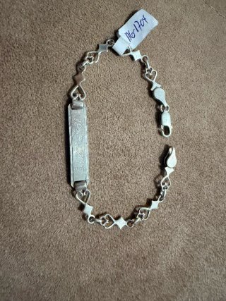Pulsera de plata con placa grabada