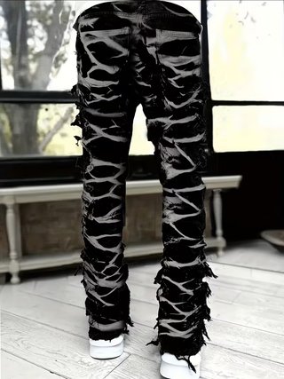 Jeans neri strappati con trame chiare