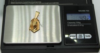 Colgante de oro de 18k. Peso: 4.92 gr.