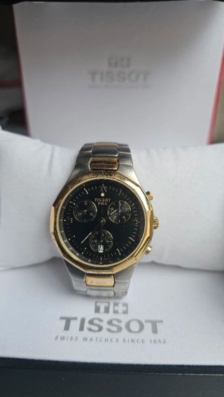 Reloj Tissot PRX Cronógrafo bicolor acero/dorado