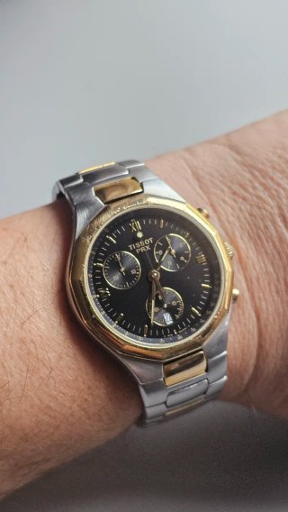 Reloj Tissot PRX Cronógrafo bicolor acero/dorado