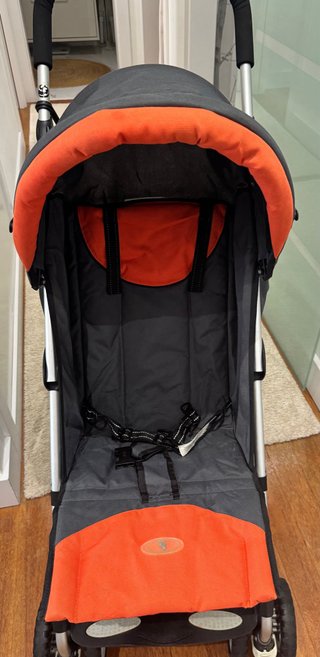 Silla de paseo paraguas naranja y negra