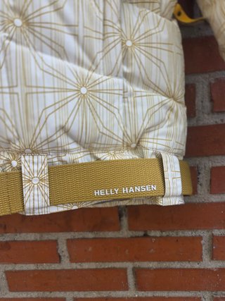 Chaqueta Helly Hansen dorada y blanca talla S