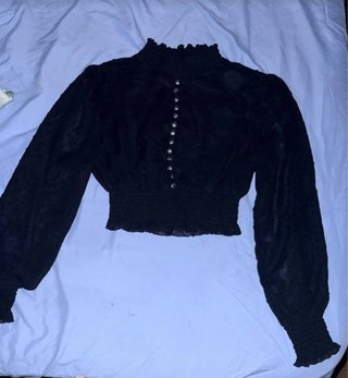 Blusa negra manga larga cuello alto