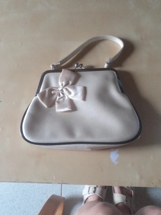 Bolso de mano de vestir con lazo