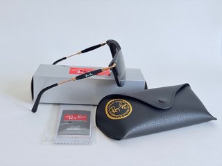 Gafas de sol Ray-Ban negras y doradas Polarizadas