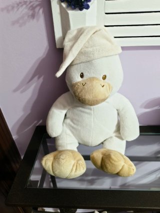 Peluche de pato con gorro de dormir