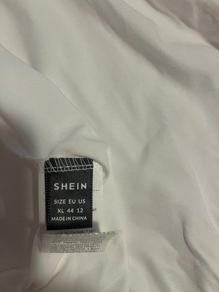 Vestido de playa blanco con flecos
