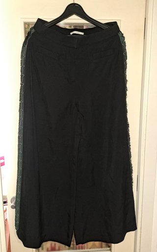 Pantalón Uterqüe con detalle de flecos