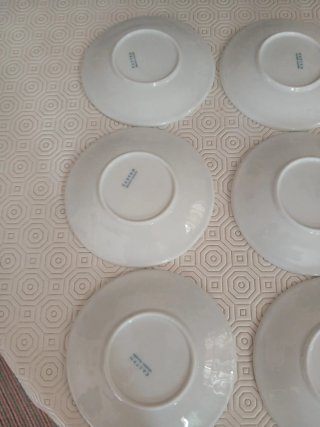 9 Platitos de Porcelana Blanca de Castro.