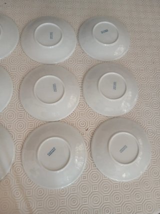 9 Platitos de Porcelana Blanca de Castro.