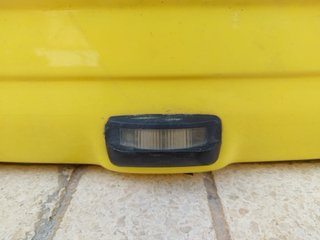Paragolpes Trasero Ford Escort Amarillo año 1992