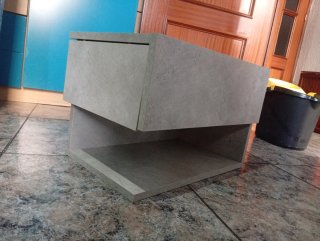 Cabecero gris con mesita flotante