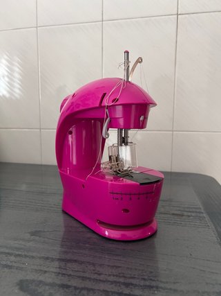 Máquina de coser infantil rosa