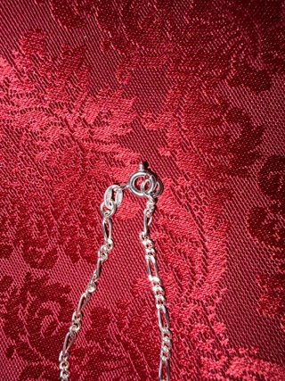 Cadena ( 70cm) y pulsera de plata (21 cm).
