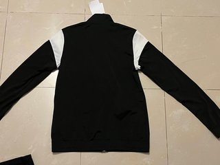 Conjunto deportivo Puma negro y blanco