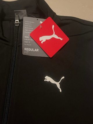 Conjunto deportivo Puma negro y blanco