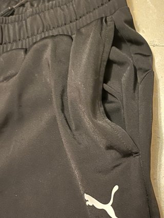 Conjunto deportivo Puma negro y blanco