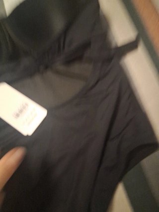 Bañador negro strapless con detalles dorados