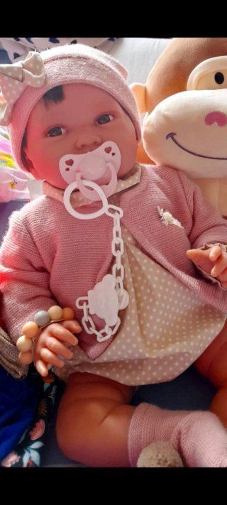 Muñeca bebé realista con chupete