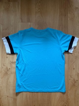 Camiseta deportiva Puma azul y blanca