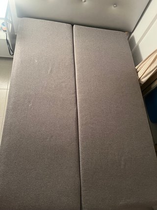 Divano letto grigio Ikea con spazio di archiviazione