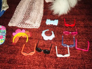 Consiglio di vestiti e accessori per bambole Barbie