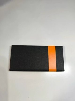 Funda gafas Timberland negra y naranja sin usar