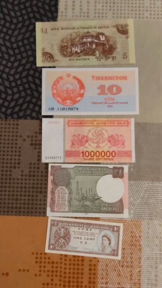 Lotto di 16 banconote del Vietnam, Yemen, Burma e altri