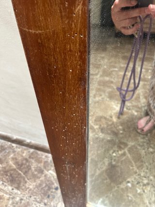 Espejo antiguo de madera con marco tallado