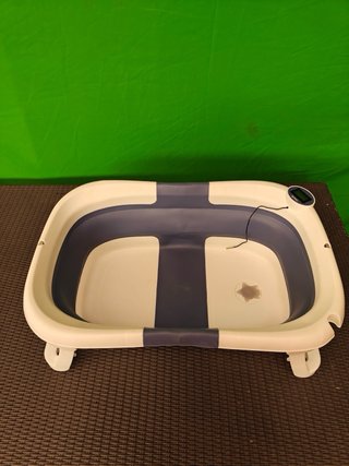Bañera bebé plegable con termómetro incorporado.