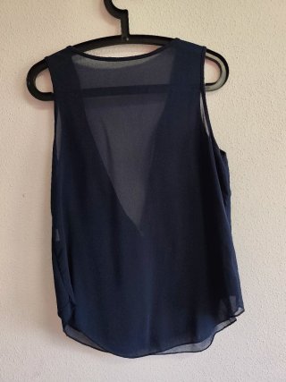 Blusa sin mangas de chica talla S-M.