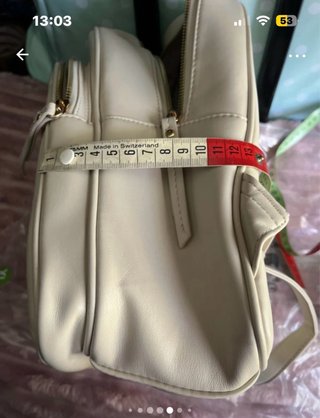 Mochila beige acolchada nueva