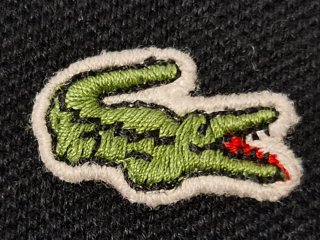 Polo Lacoste sin mangas negro, t. 44 (L)