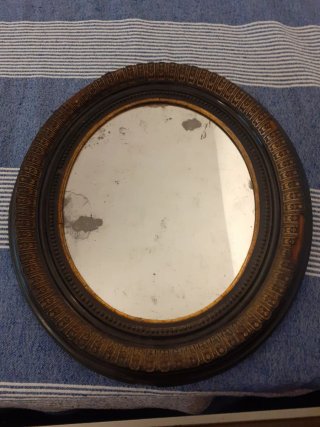 Specchio ovale vintage nero e oro