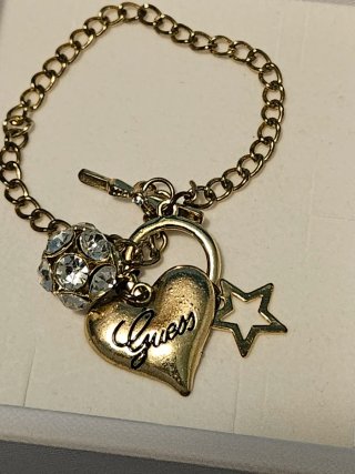 Pulsera Guess Corazón y Estrella Dorada