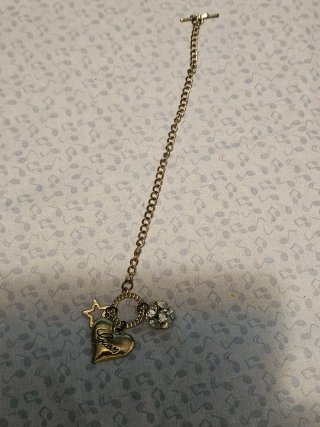 Pulsera Guess Corazón y Estrella Dorada