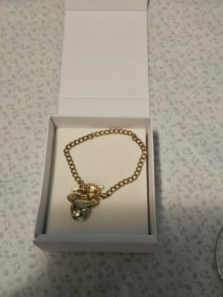 Pulsera Guess Corazón y Estrella Dorada