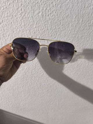 Gafas de sol Prada doradas y negro