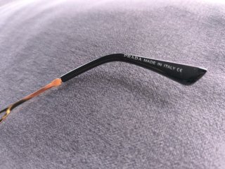 Gafas de sol Prada doradas y grises