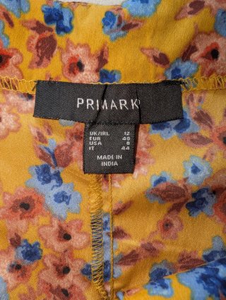 Mono corto floral Primark talla 40 amarillo