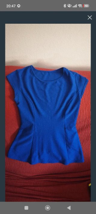 Blusa azul con volantes talla S