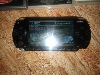 PSP con 2 juegos y película Resident Evil