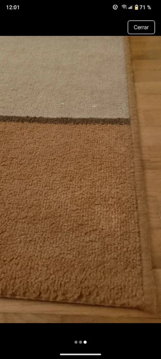 Alfombra de tela beige y naranja