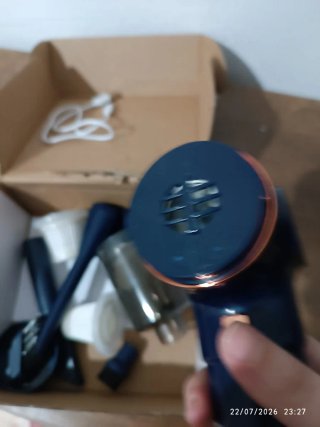 Mini aspirador a batería azul, nuevo.