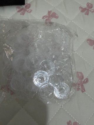 Lote de canillas transparentes para máquina de cos