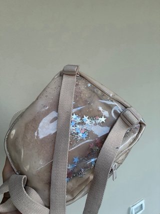 Zainetto beige con glitter e pompon