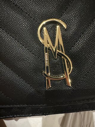 Bolso bandolera Steve Madden negro y dorado