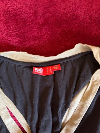 Camiseta sin mangas Puma mujer negra y dorada