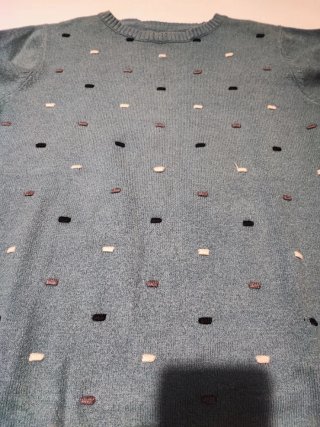 Jersey de punto verde con detalles